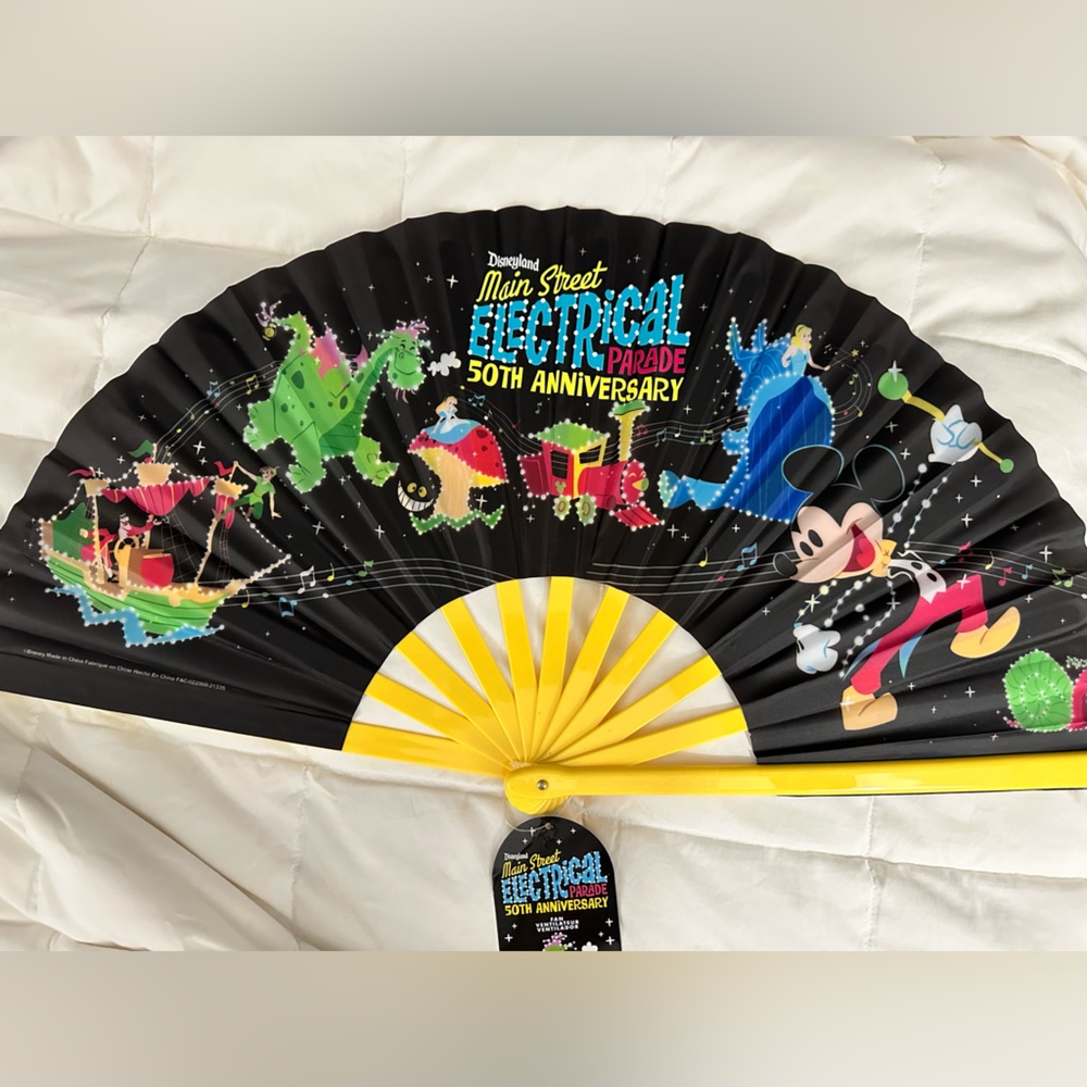 NWT. Disney Large fan with Electrical Parade Folding Hand Fan.